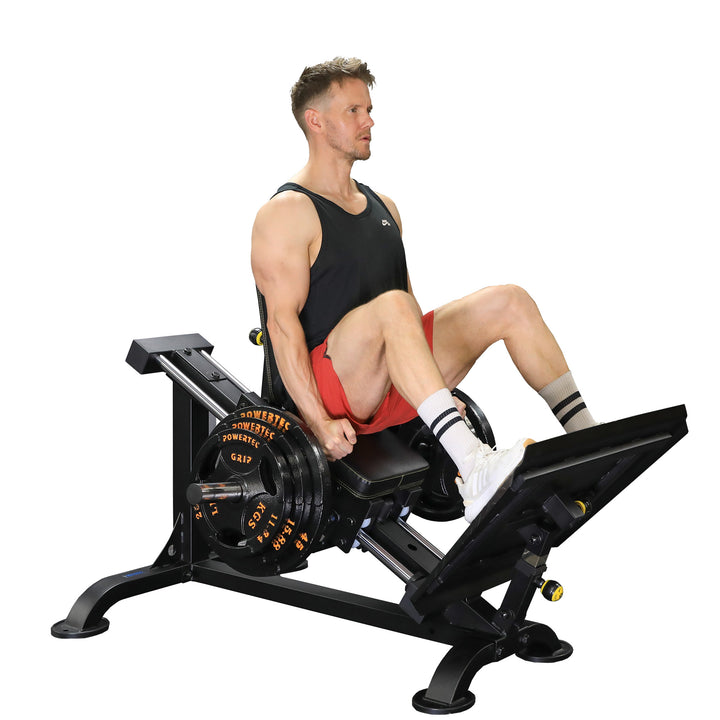 Side view of sled seat and adjustable back pad with footplate and hand grip setup for ergonomic leg press posture.