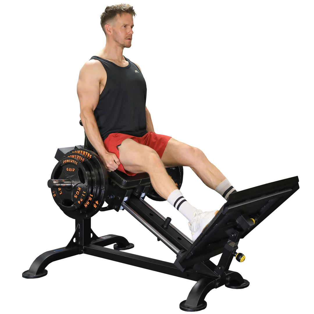 Side view of sled seat and adjustable back pad with footplate and hand grip setup for ergonomic leg press posture.