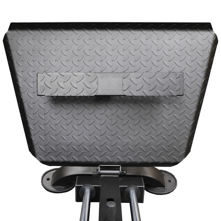 Close‑up of sled carriage wheels and steel guide rods demonstrating nylon‑bearing assembly for smooth motion.