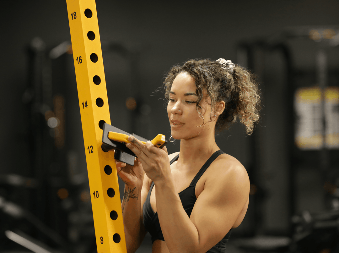 Premium Photo  Muscular woman using the fitness equipment during the  strength workout