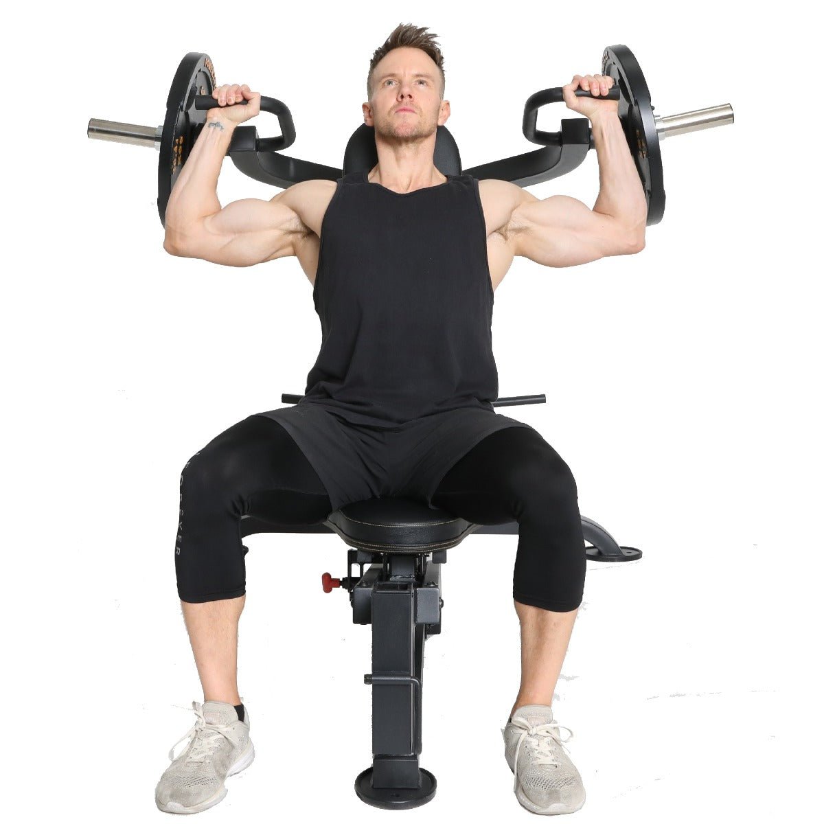 Rob Riches performing a seated shoulder press exercise.